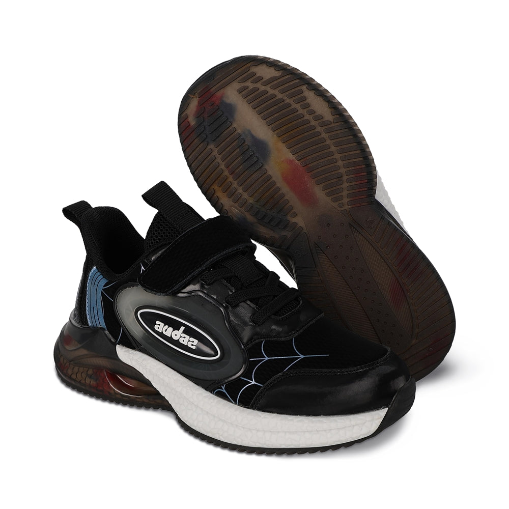 Tenis Audaz para niño en textil negro Rex con tira de contacto.