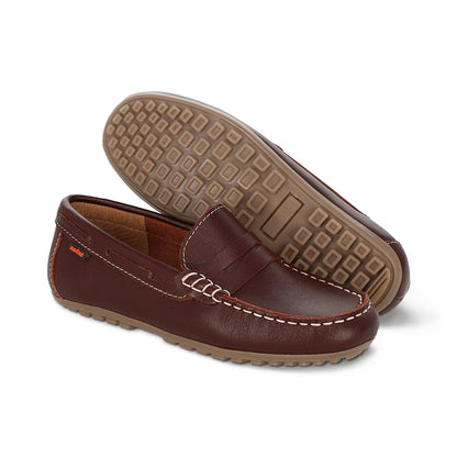 Mocasín Audaz para niño en piel  ladrillo Malaga con suela resistente.