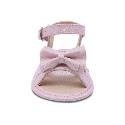 Sandalia Coqueta para niña en sintético rosa Eredi con detalle de moño.