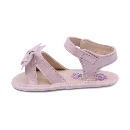 Sandalia Coqueta para niña en sintético rosa Eredi con detalle de moño.